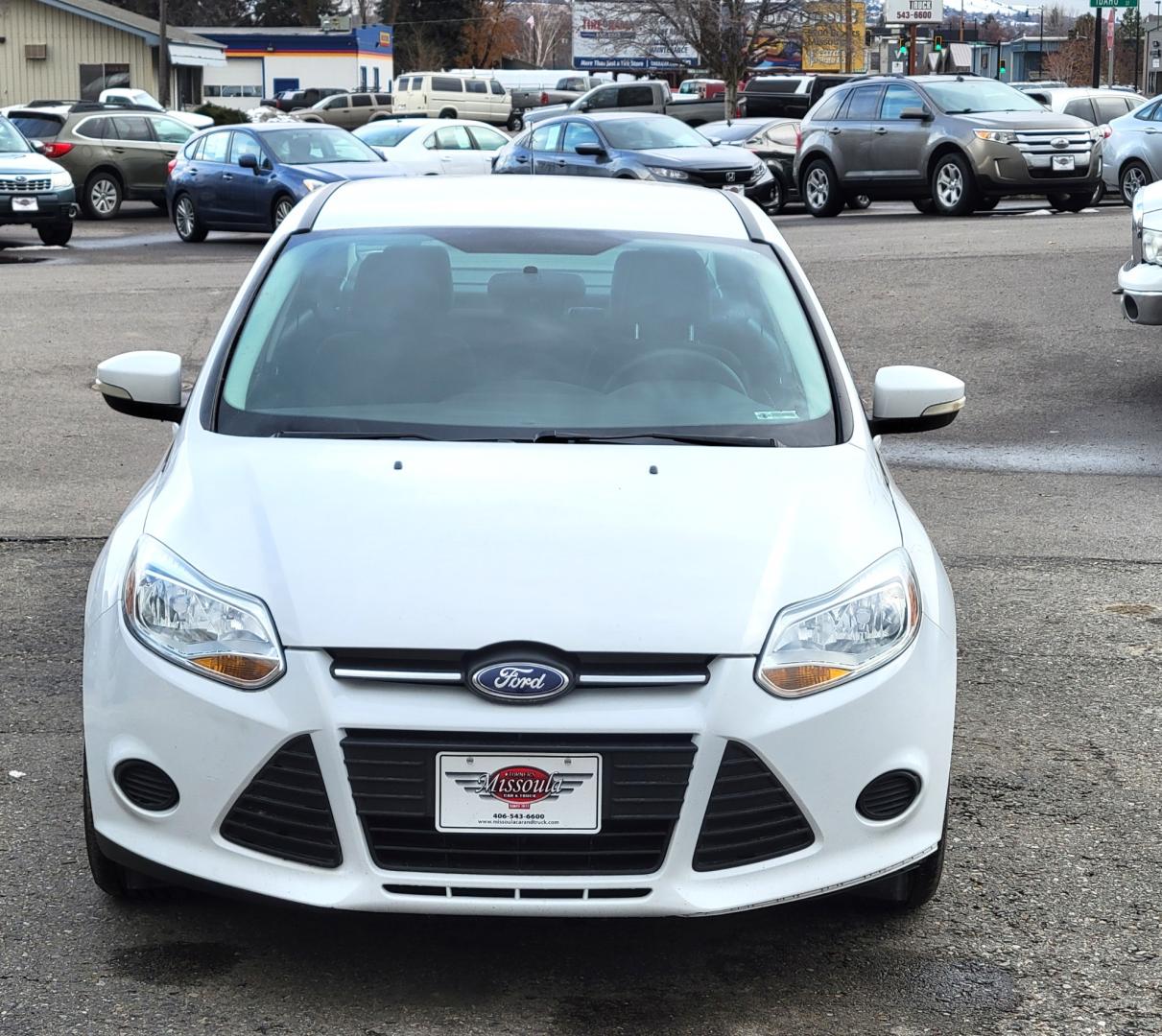 2013 White /Black Ford Focus SE (1FADP3F23DL) with an 2.0L I4 engine, 6 Speed Automatic transmission, located at 450 N Russell, Missoula, MT, 59801, (406) 543-6600, 46.874496, -114.017433 - Great Little Sedan. Excellent Fuel Economy. Only 69K Miles! Heated Seats. Air Cruise Tilt. Power Windows and Locks. AM FM CD XM Bluetooth. - Photo#2